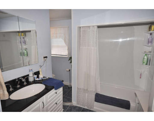 39 Inverness Road Arlington, MA 02476 - Photo 10 of 19 a bathroom with a sink a toilet a shower and a mirror