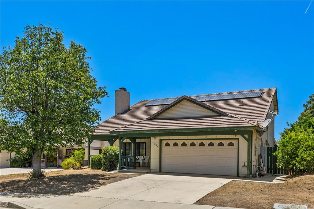 33865 Canyon Ranch Road Wildomar, CA 92595 - Photo 1 of 1 a front view of a house with a yard