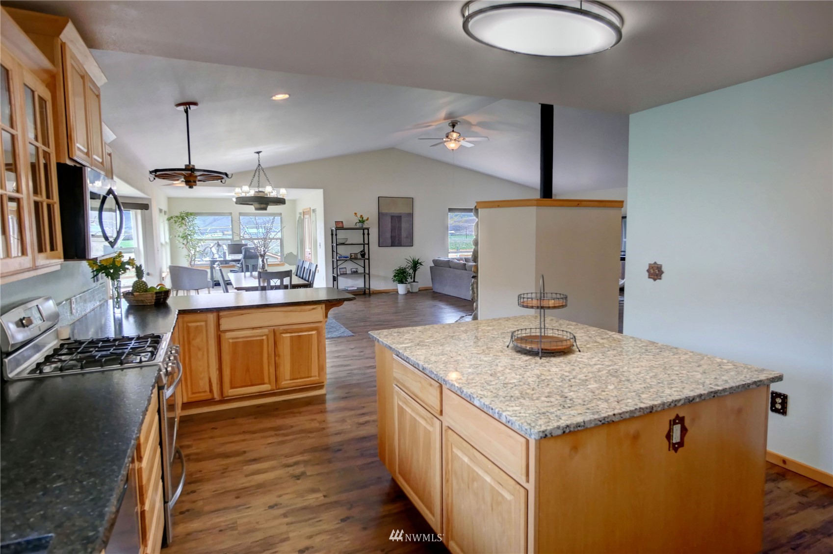 196 Pharr Road Riverside, WA 98849 - Photo 15 of 40 a kitchen with stainless steel appliances granite countertop a sink stove and refrigerator