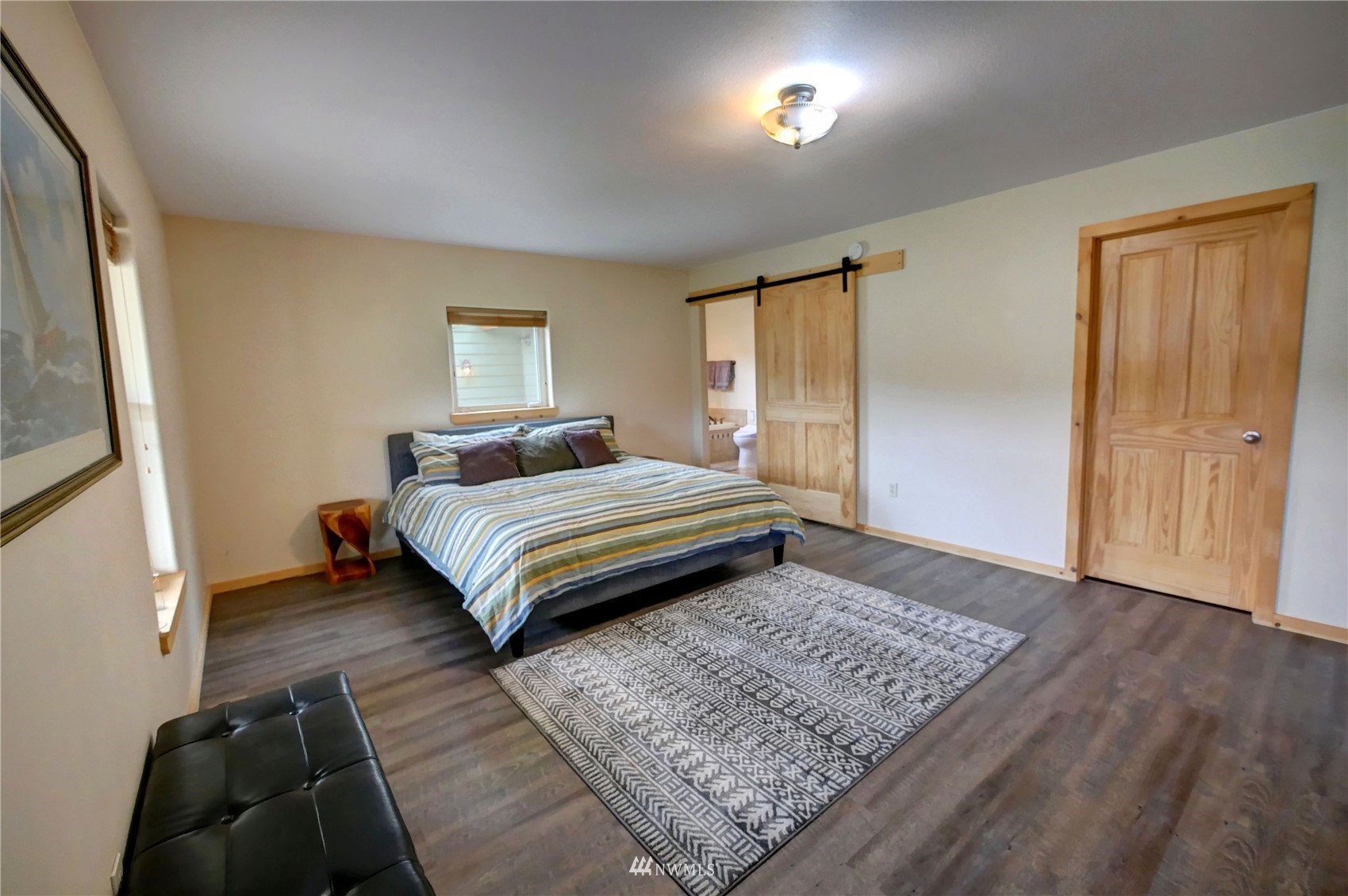 196 Pharr Road Riverside, WA 98849 - Photo 25 of 40 a bedroom with a bed and wooden floor
