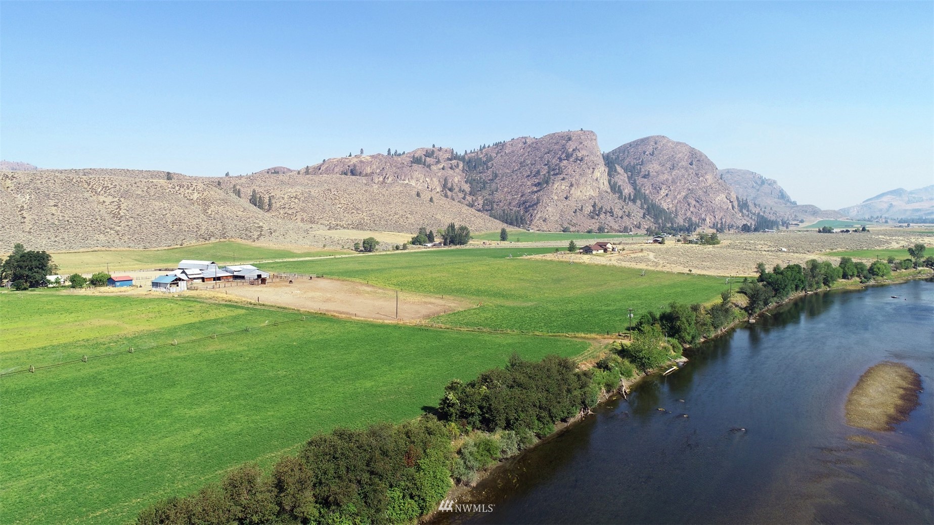 196 Pharr Road Riverside, WA 98849 - Photo 39 of 40 a view of a lush green hillside and houses