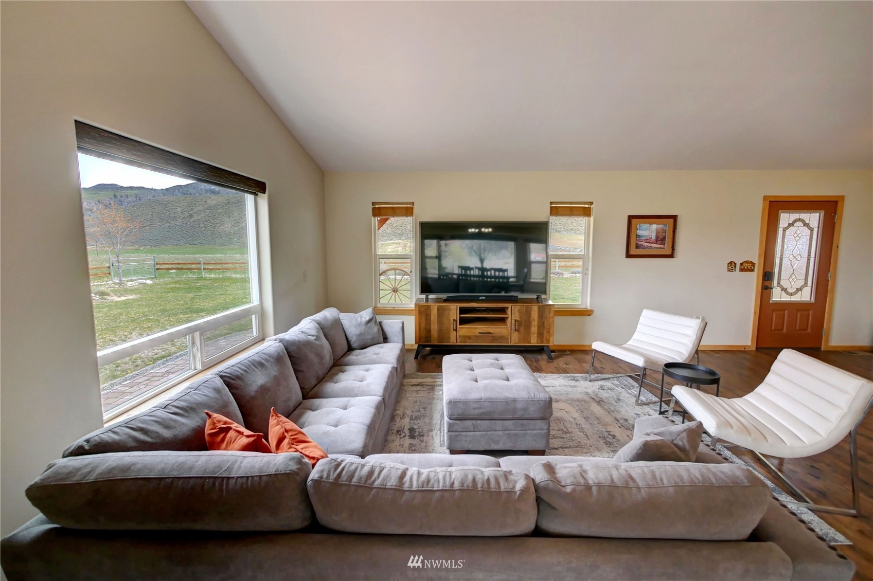 196 Pharr Road Riverside, WA 98849 - Photo 10 of 40 a living room with furniture and a flat screen tv