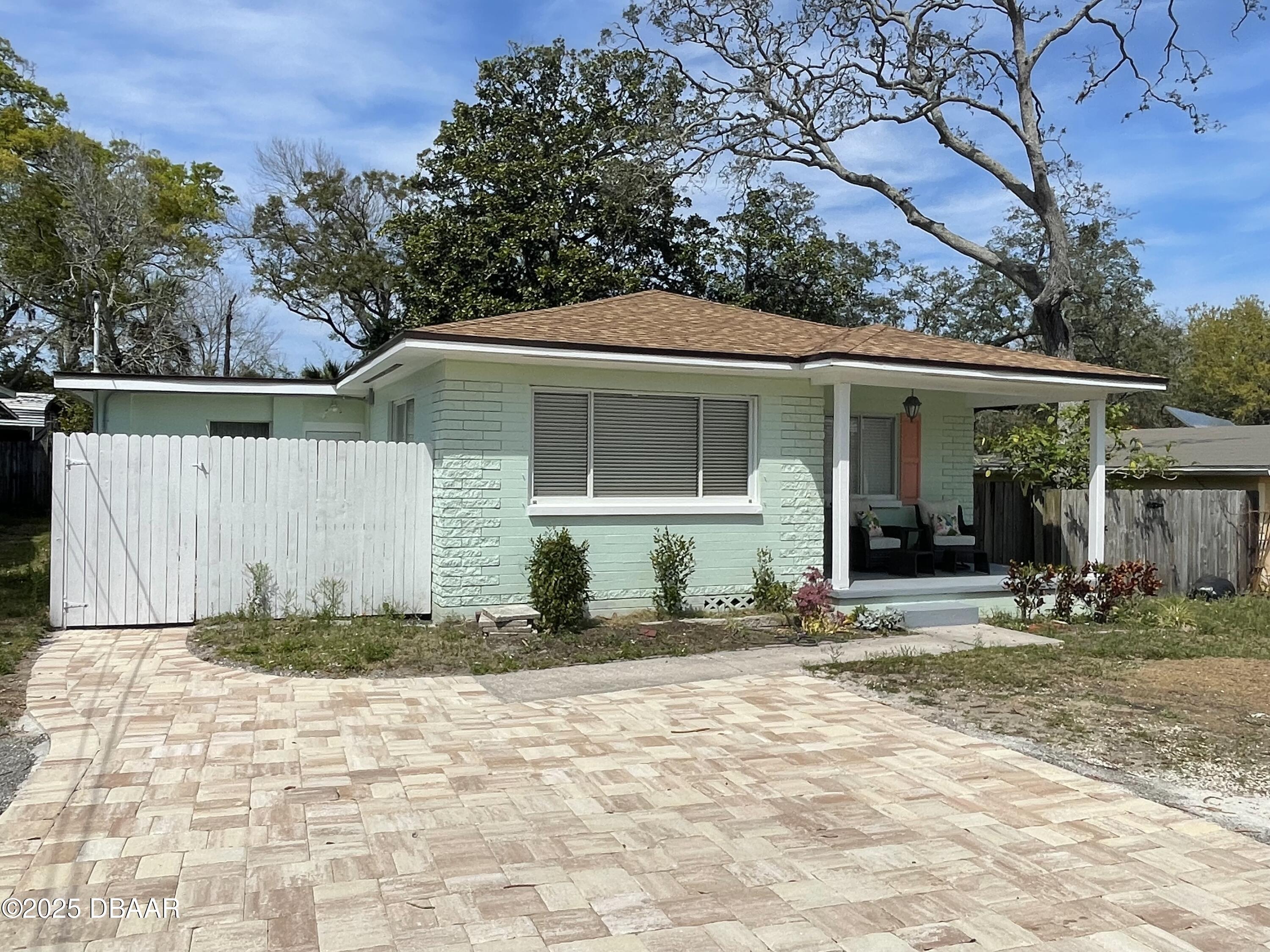 43 Warwick Avenue Ormond Beach, FL 32174 - Photo 1 of 32 a front view of a house with a yard