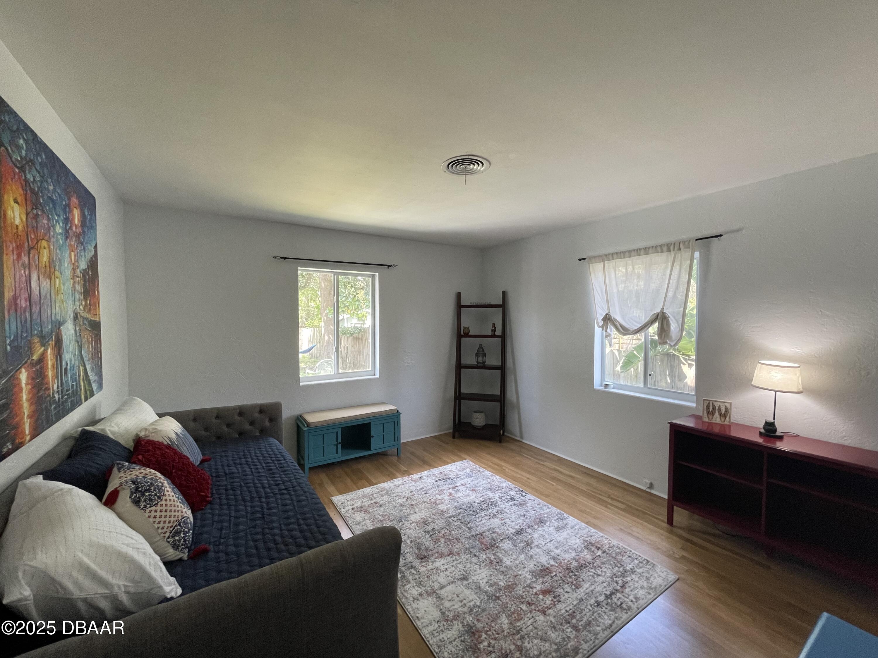 43 Warwick Avenue Ormond Beach, FL 32174 - Photo 26 of 32 a living room with furniture and a window