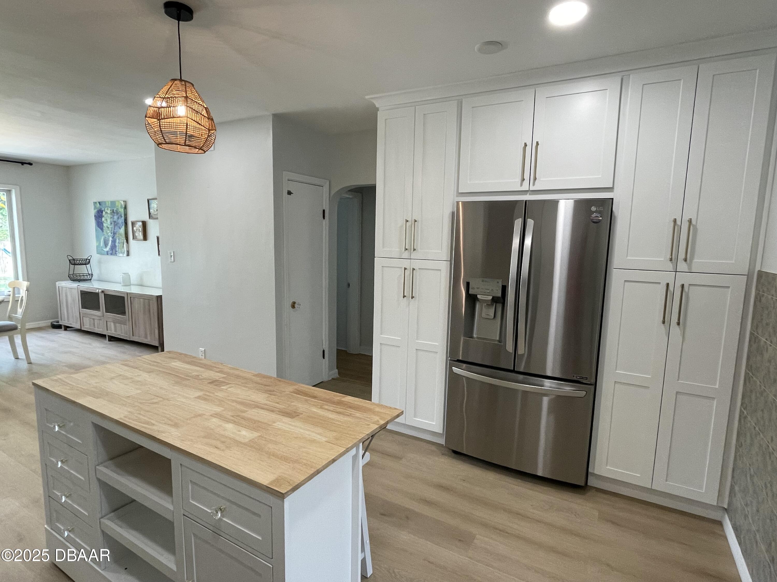 43 Warwick Avenue Ormond Beach, FL 32174 - Photo 8 of 32 a kitchen with stainless steel appliances granite countertop a refrigerator and a stove top oven