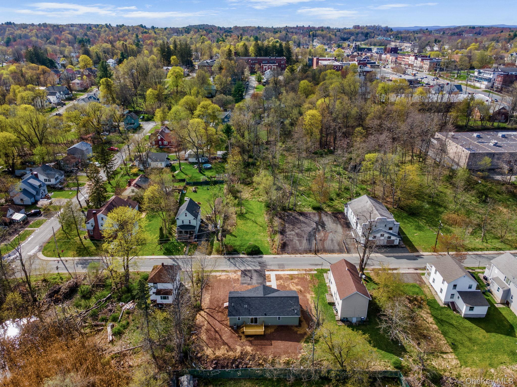 23 Spring Street Monticello, NY 12701 - Photo 42 of 44 an aerial view of residential houses with outdoor space