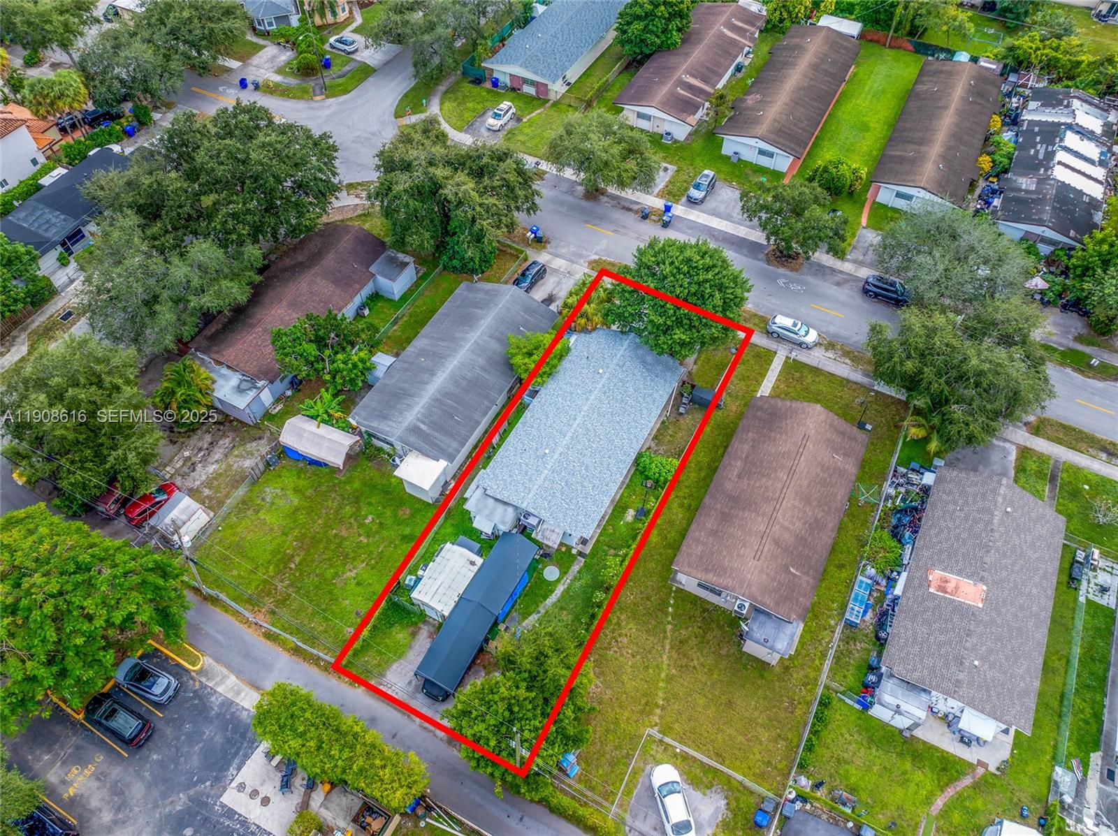 5709 Lincoln Street Hollywood, FL 33021 - Photo 12 of 17 an aerial view of a tennis ground and a yard