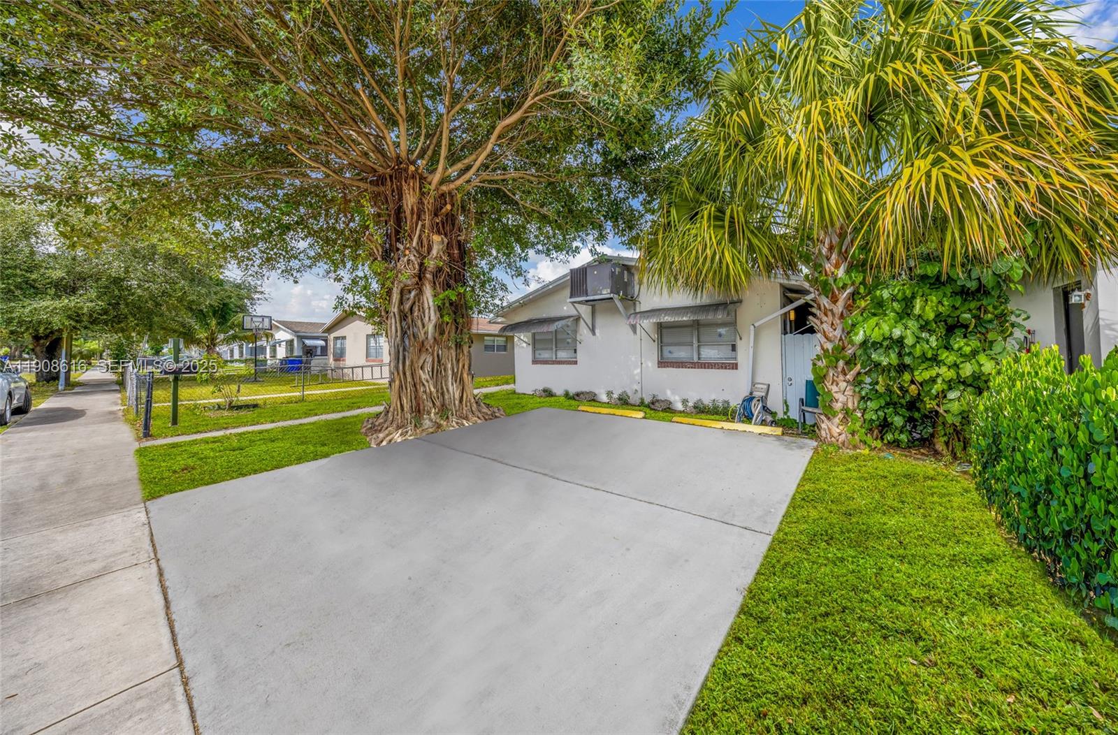 5709 Lincoln Street Hollywood, FL 33021 - Photo 3 of 17 a view of swimming pool with tree s