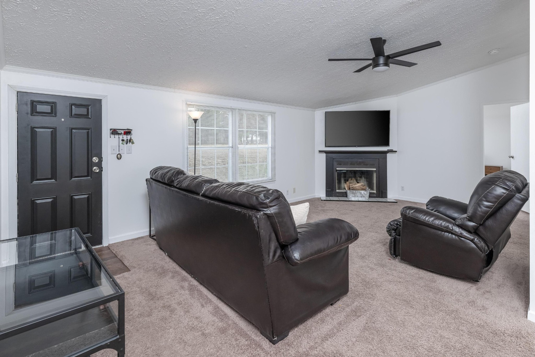 720 Armstrong Road Southeast Cleveland, TN 37323 - Photo 3 of 16 a living room with furniture and a fireplace