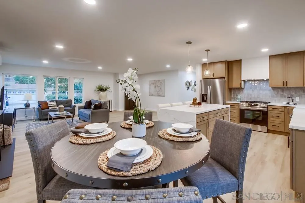 12378 Wade Way El Cajon, CA 92021 - Photo 19 of 48 a kitchen with a dining table and chairs