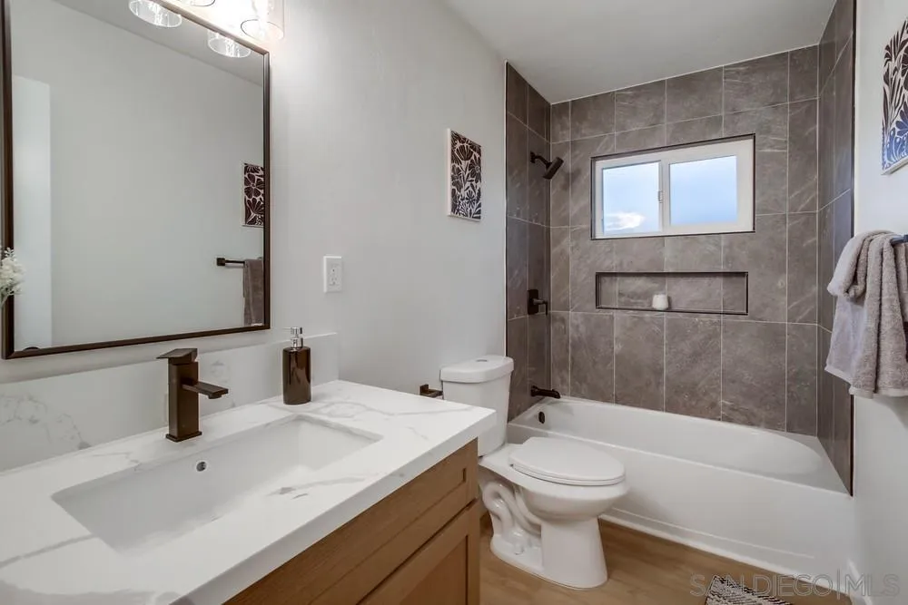 12378 Wade Way El Cajon, CA 92021 - Photo 25 of 48 a bathroom with a sink a toilet and shower
