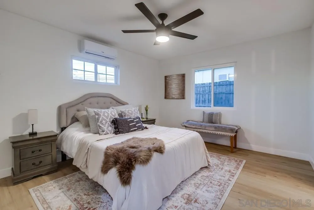 12378 Wade Way El Cajon, CA 92021 - Photo 33 of 48 a bedroom with a large bed and a window