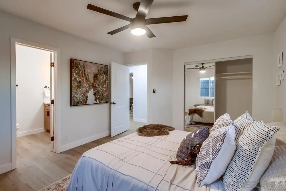 12378 Wade Way El Cajon, CA 92021 - Photo 36 of 48 a bedroom with a bed and a painting on the wall