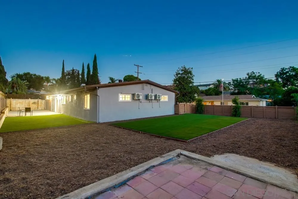 12378 Wade Way El Cajon, CA 92021 - Photo 10 of 48 a view of a house with a yard and a large tree