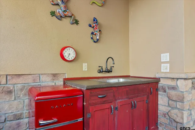 a view of storage and utility room with a sink