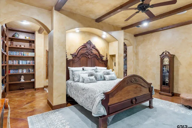 a bedroom with a bed and walk in closet