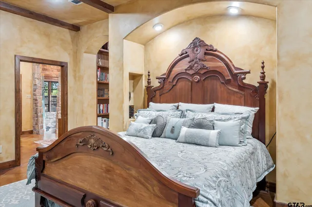 a bedroom with a bed and window