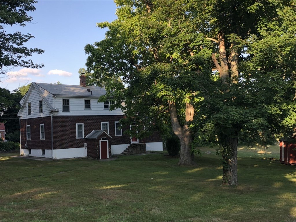 90 Swan Road Smithfield, RI 02917 - Photo 4 of 11 Back yard view of the farm house