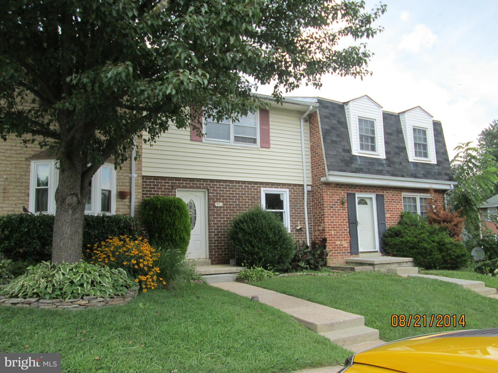 416 Falling Spring Court Reisterstown, MD 21136 - Photo 1 of 16 a front view of a house with a garden and plants
