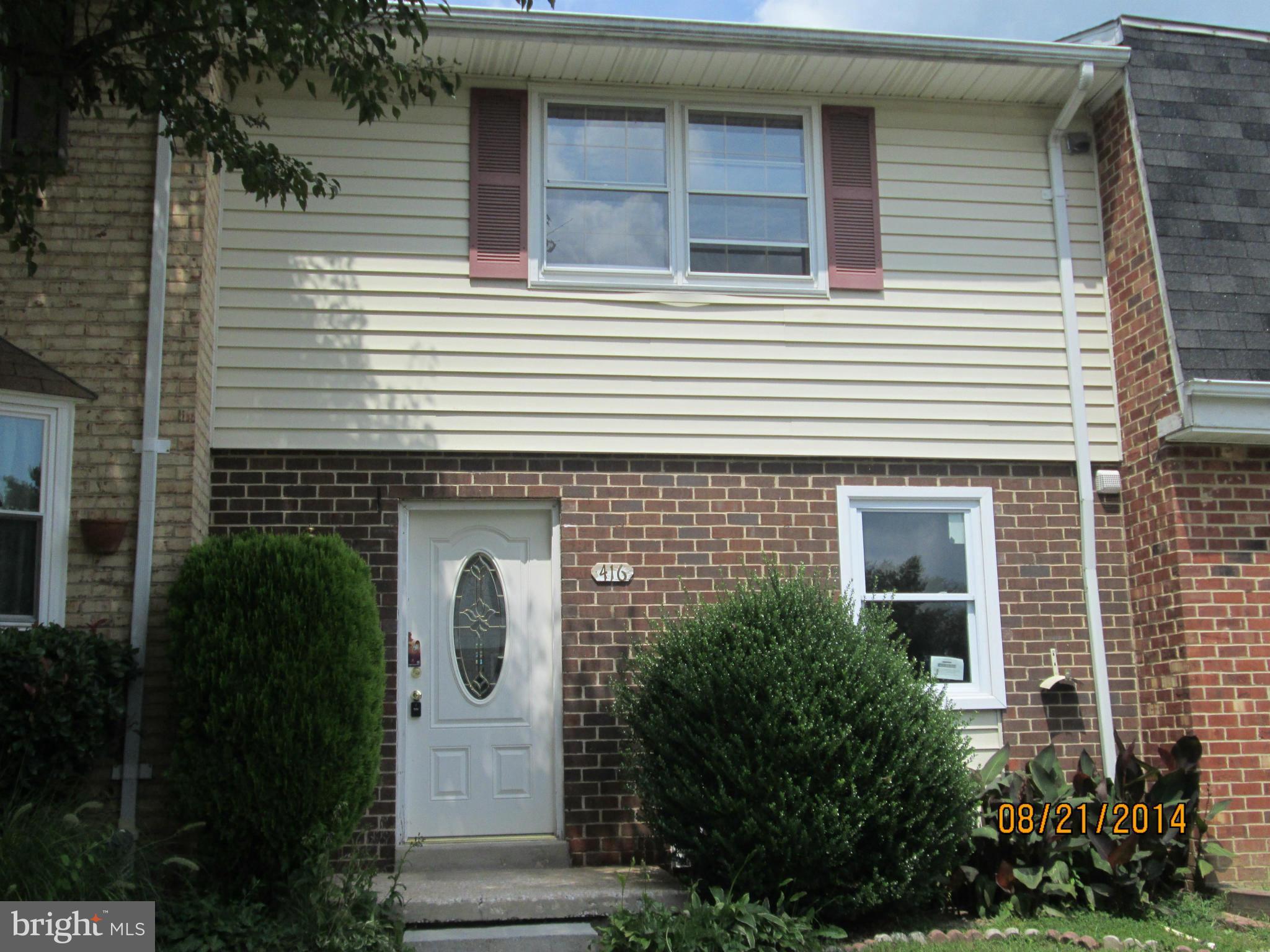 416 Falling Spring Court Reisterstown, MD 21136 - Photo 2 of 16 a front view of a house with a garden