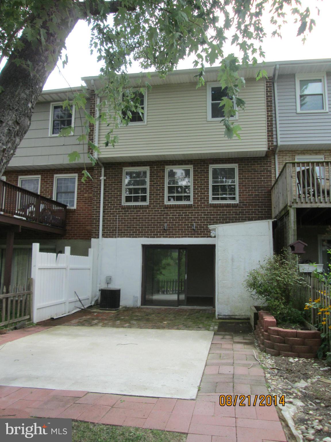 416 Falling Spring Court Reisterstown, MD 21136 - Photo 4 of 16 a front view of a house with a yard and garage