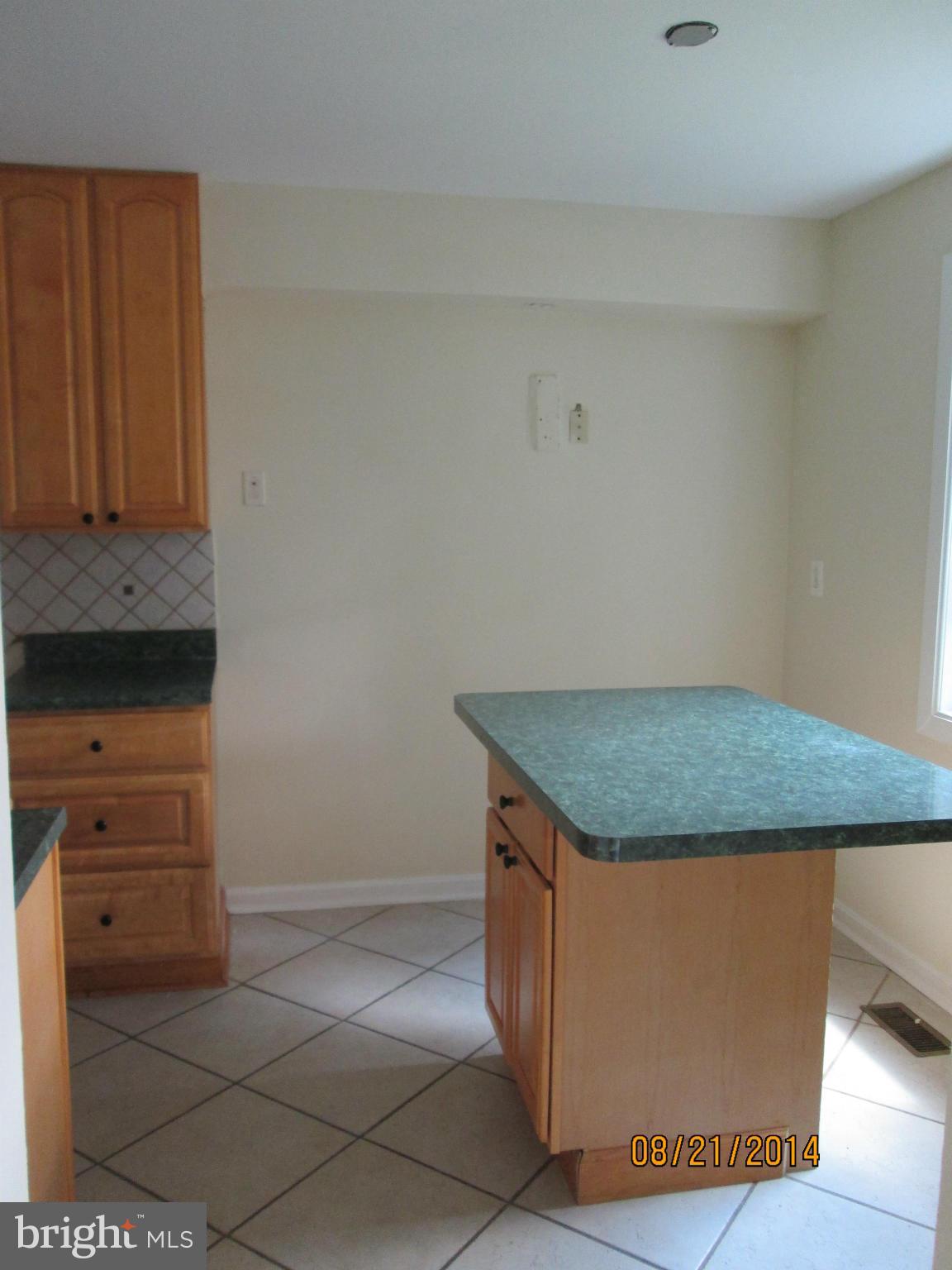 416 Falling Spring Court Reisterstown, MD 21136 - Photo 7 of 16 a utility room with granite countertop cabinets and utility room view