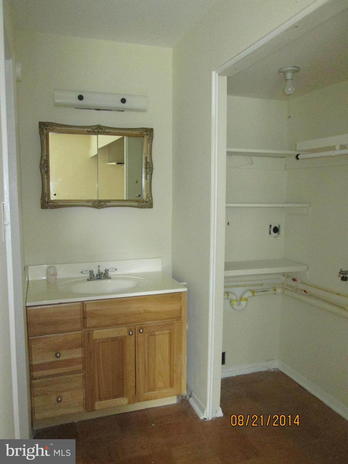 416 Falling Spring Court Reisterstown, MD 21136 - Photo 8 of 16 a bathroom with a sink a vanity and a window