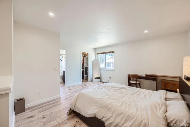 a bedroom with a bed and a dresser