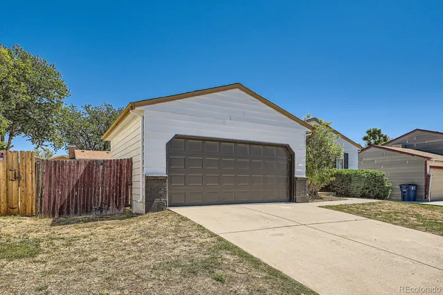 a front view of a house with a garage