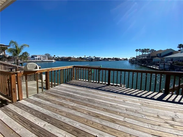 a view of balcony with wooden floor and city view