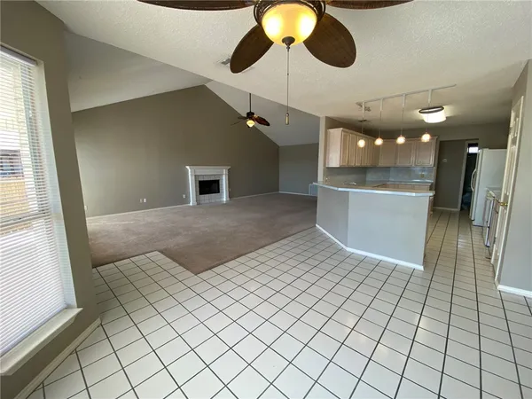 a view of a hallway with a chandelier