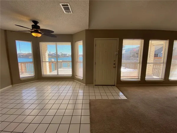 a view of an empty room and window