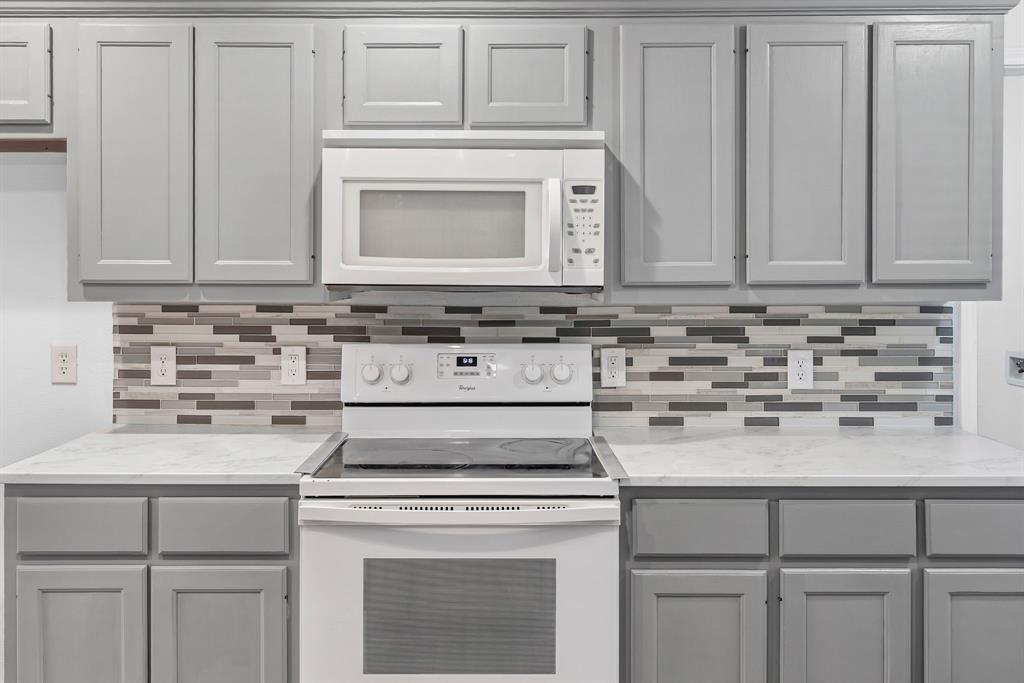 741 Southwest 9th Street Cooper, TX 75432 - Photo 14 of 36 a kitchen with cabinets appliances and a sink