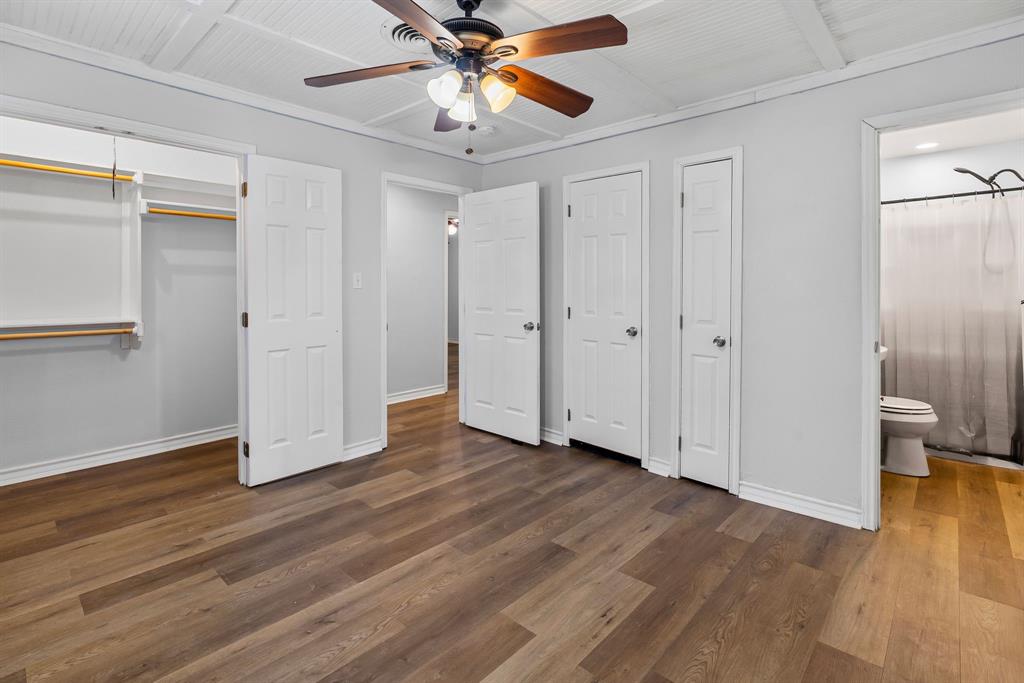 741 Southwest 9th Street Cooper, TX 75432 - Photo 24 of 36 a view of an empty room with wooden floor