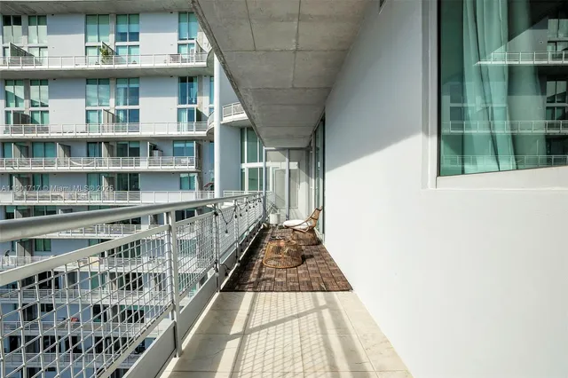 a view of balcony with furniture and outdoor view