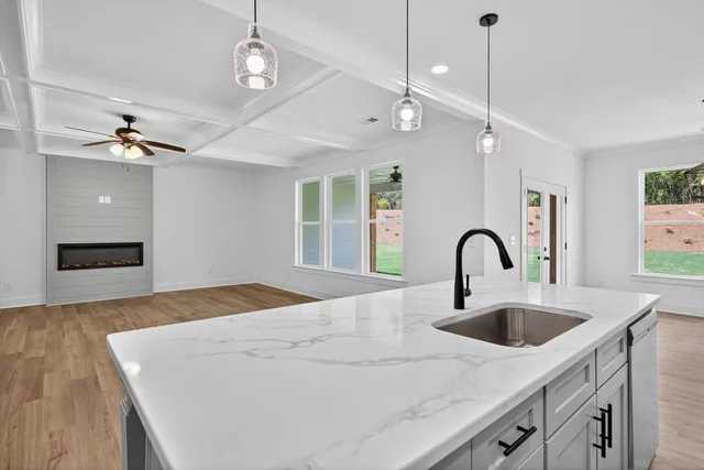 a view of an entryway with wooden floor
