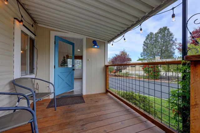 a view of a porch with wooden floor