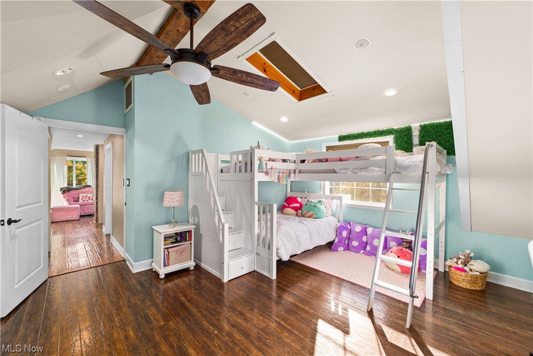 482 Trebisky Road Cleveland, OH 44143 - Photo 17 of 35 Hardwood floored bedroom featuring multiple windows, vaulted ceiling high, and ceiling fan