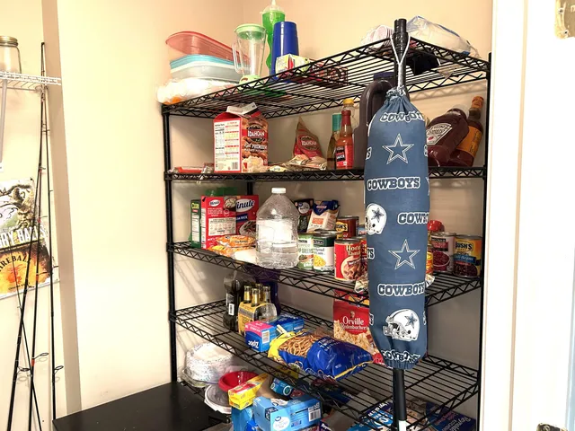 a roof deck with a couple of chairs