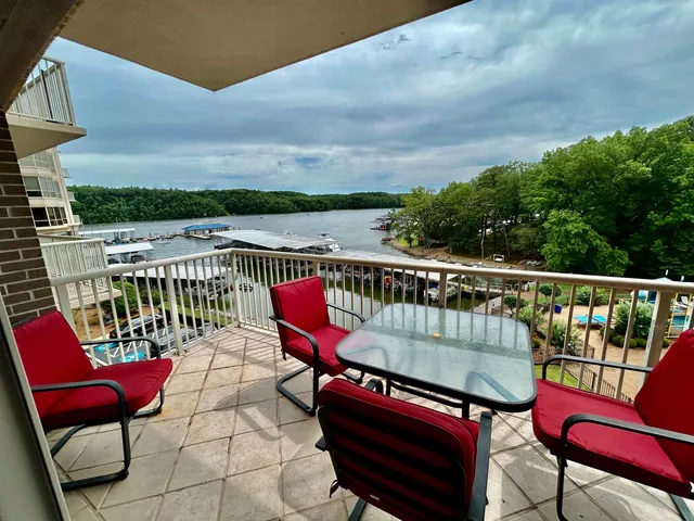 a roof deck with a table and chairs