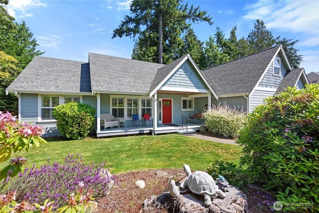 a view of a house with a yard and garden