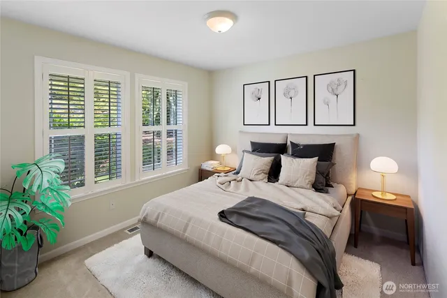 a bedroom with bed and a window