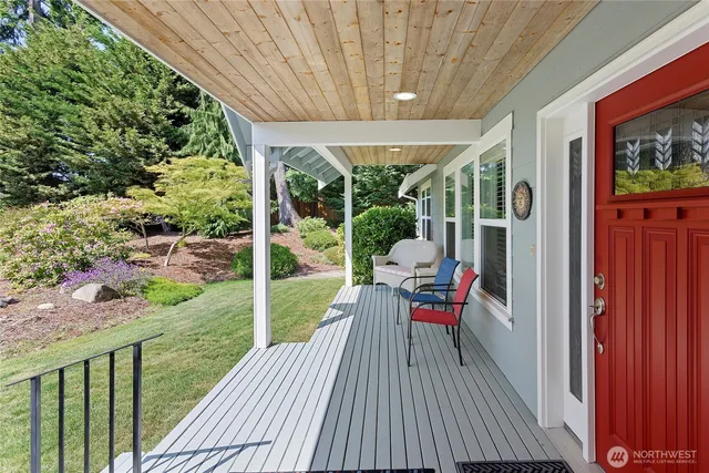 a view of a chair and table in the balcony