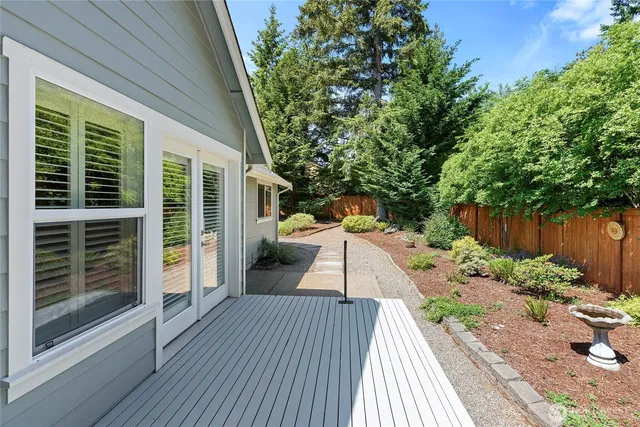 a deck view with a seating space and garden view