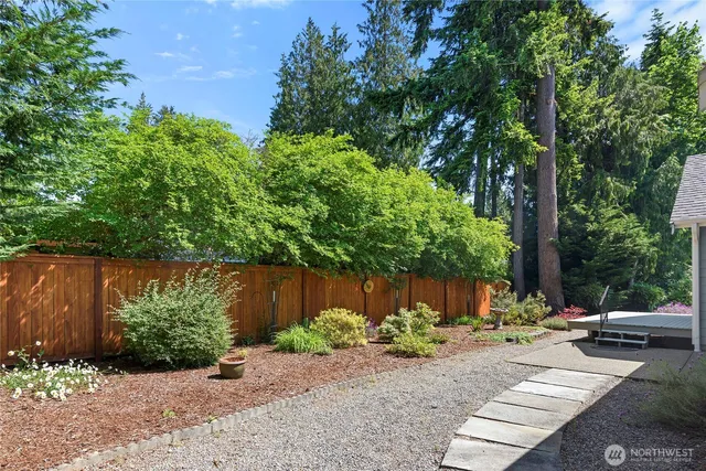 a view of a park with plants and a bench
