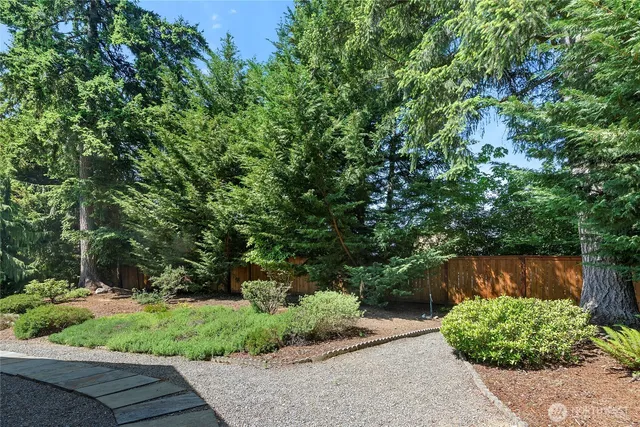 a backyard of a house with lots of green space