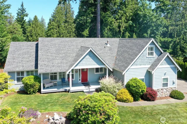 a view of a house with a yard and garage
