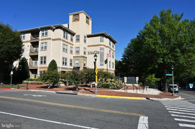 a view of a building with a street
