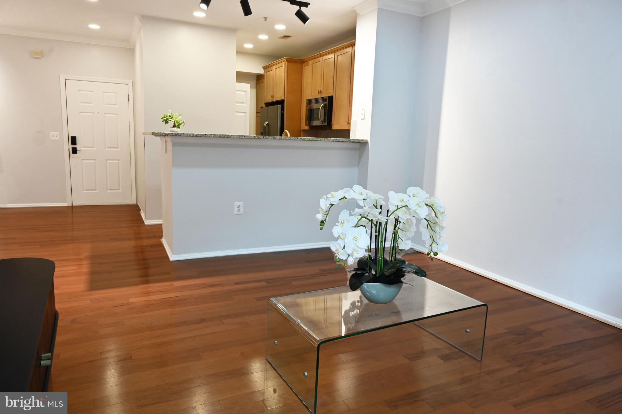 11800 Old Georgetown Road, Unit 1537 North Bethesda, MD 20852 - Photo 5 of 20 a view of kitchen with stainless steel appliances granite countertop cabinets a sink and a wooden floor