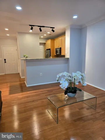 a view of a room with wooden floor